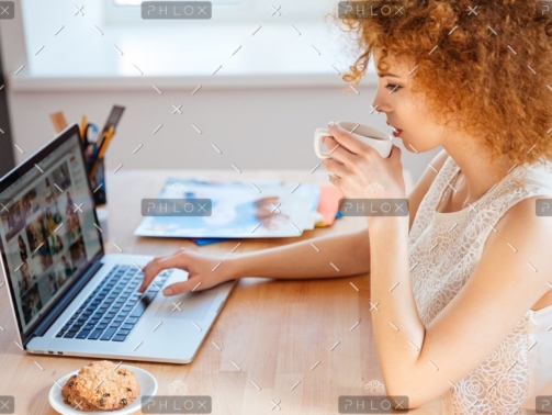 demo attachment 218 woman photographer drinking coffee and working pjnbp6u@2x